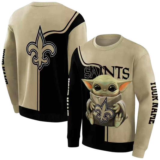 New Orleans Saints Baby Yoda Hug Logo Gold Black AOP Sweatshirt - Moonbestprint