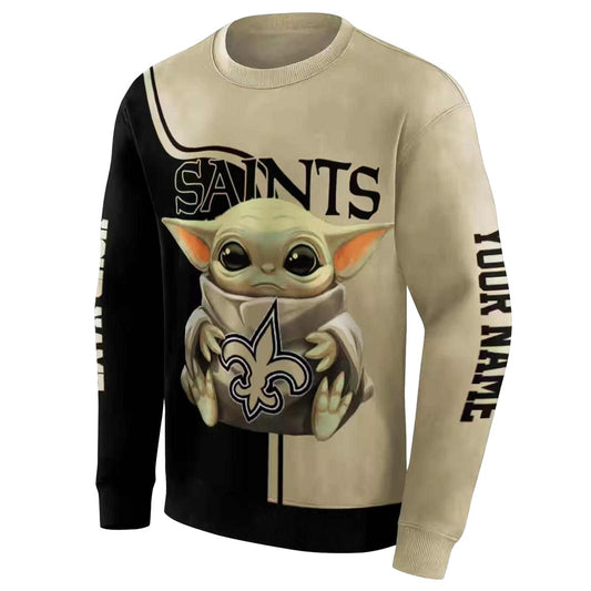 New Orleans Saints Baby Yoda Hug Logo Gold Black AOP Sweatshirt - Moonbestprint